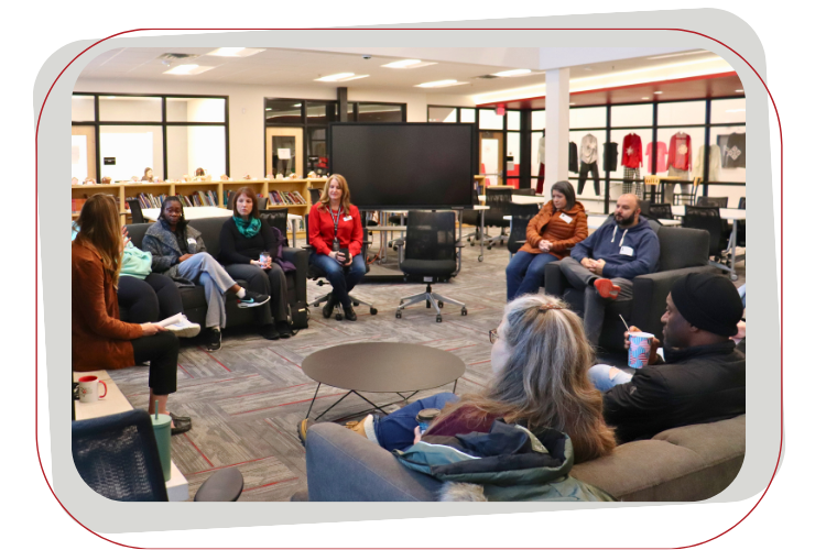 group of people talking in library